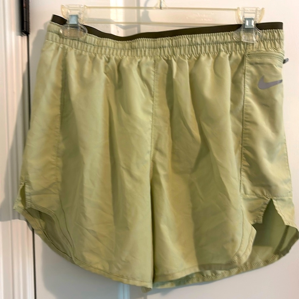 Nike Dri-fit run short with side zipper pocket.  Celery color